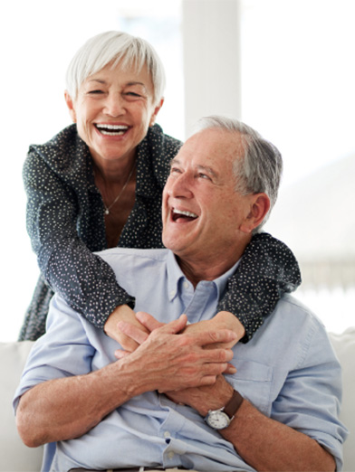 Retired Couple Smiling After Retirement Planning
